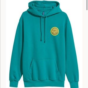 Teal H&M hoodie with Hypnotizer patch on front